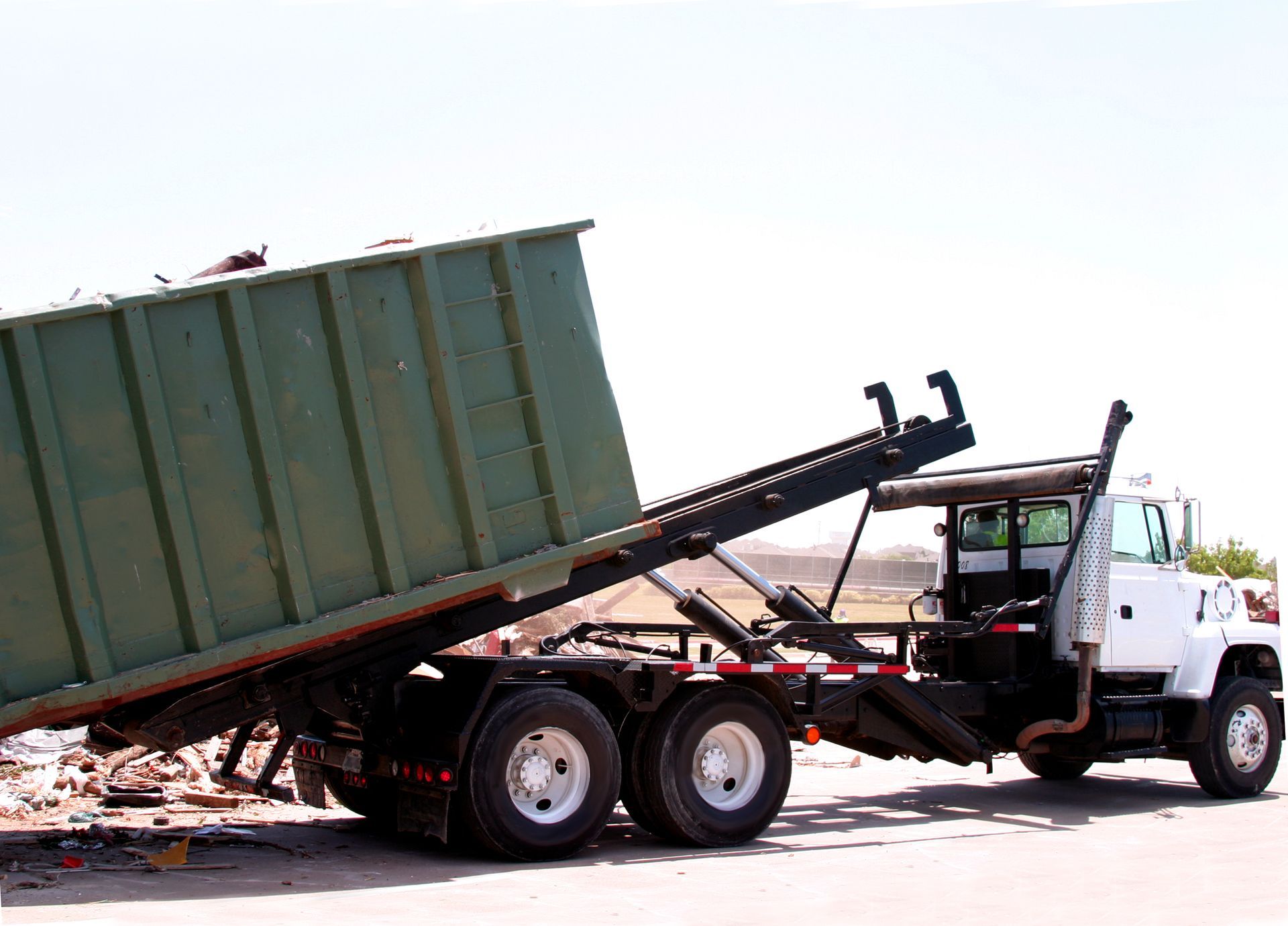 Unloading Roll Off Dumpster — Brewster, NY — Tri County Carting Sand Blasting & Welding Services