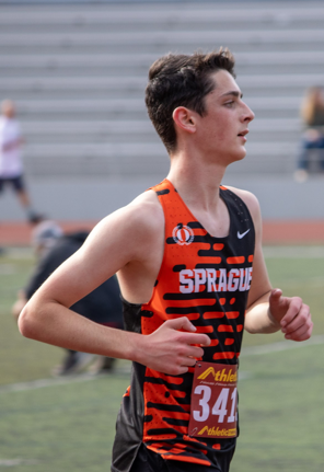 Male runner in orange and black Sprague jersey, number 341, on a track.