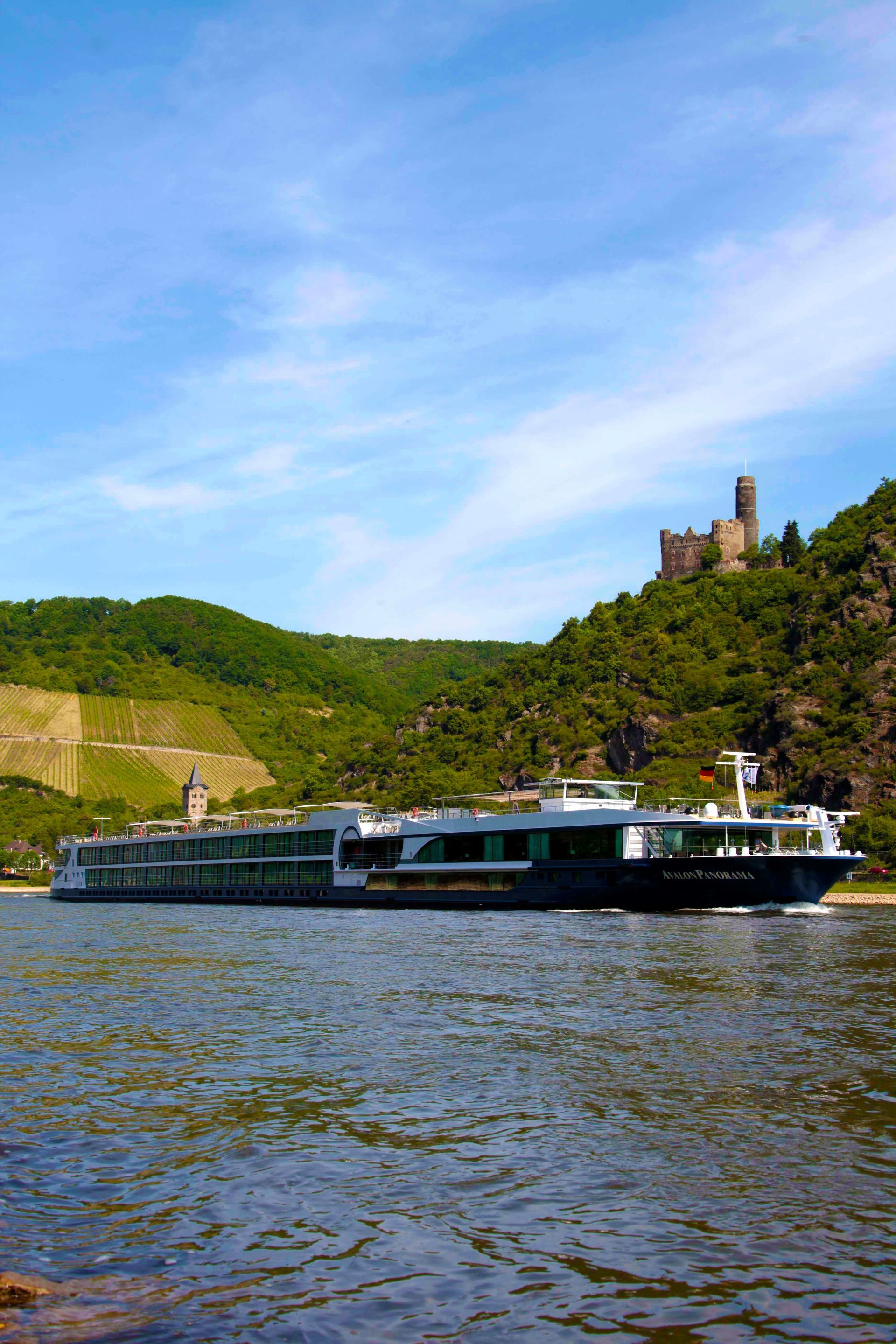 A large cruise ship is floating on top of a body of water.