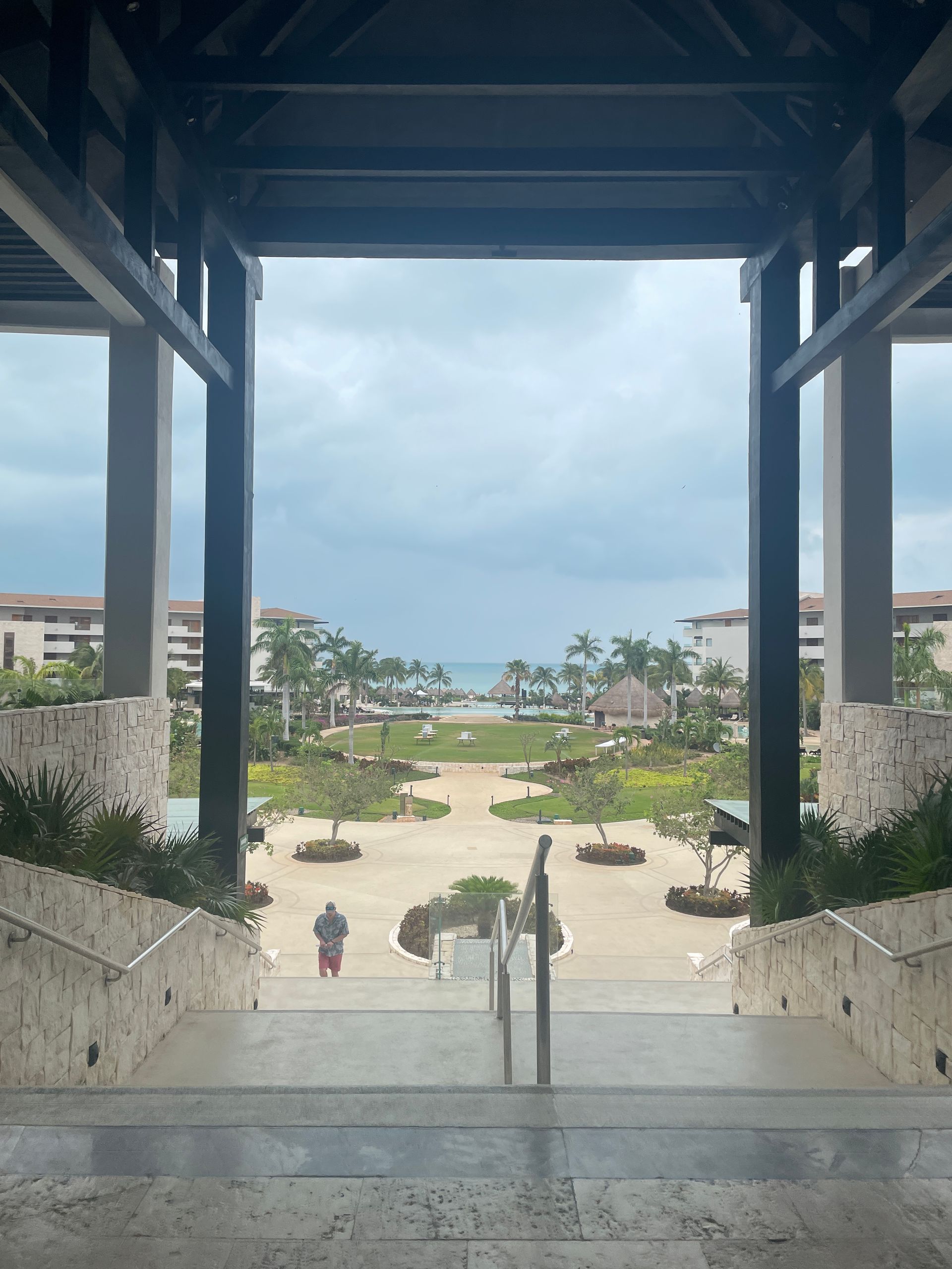 Stairs leading up to a building with a view of the ocean