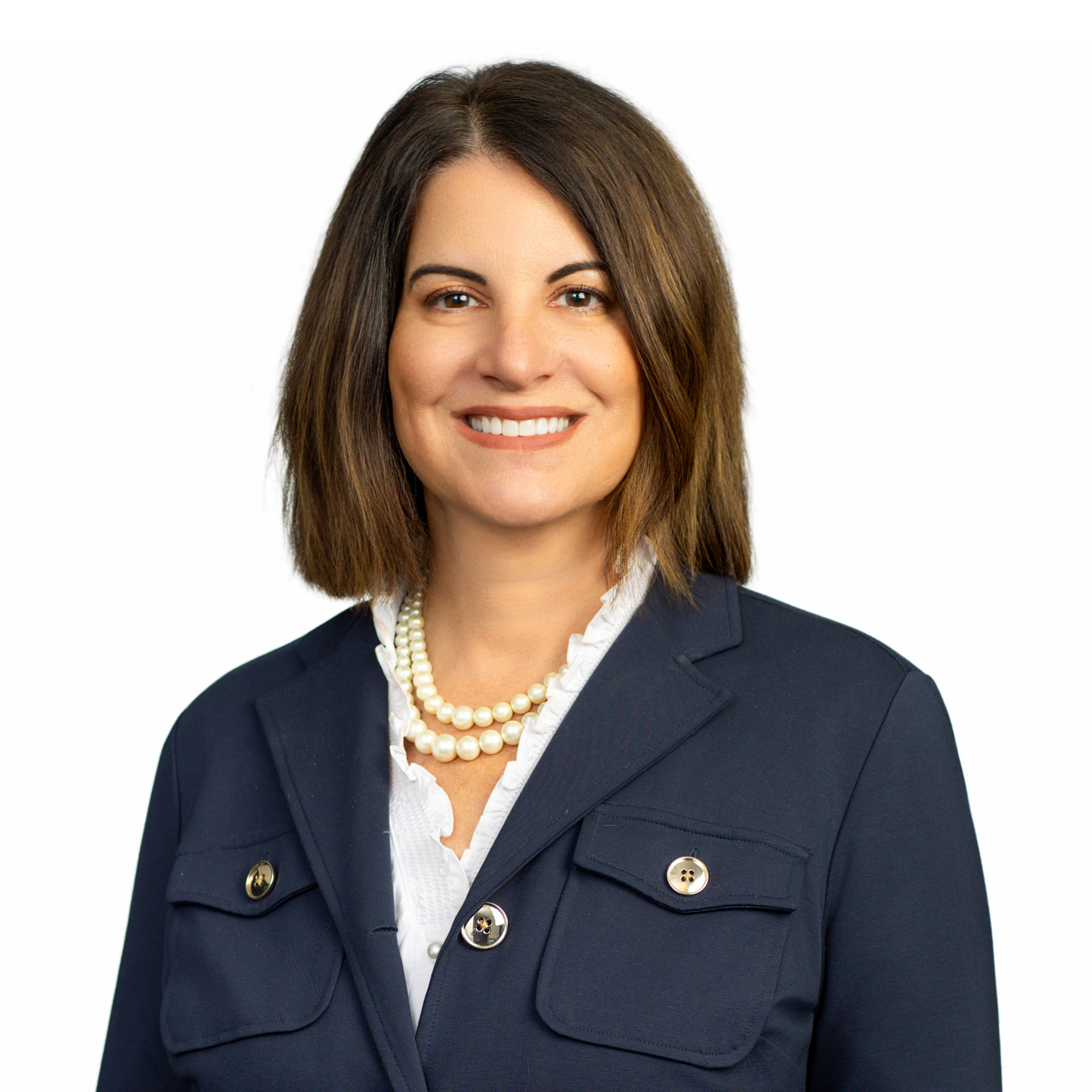 A woman with brown hair is smiling for the camera.