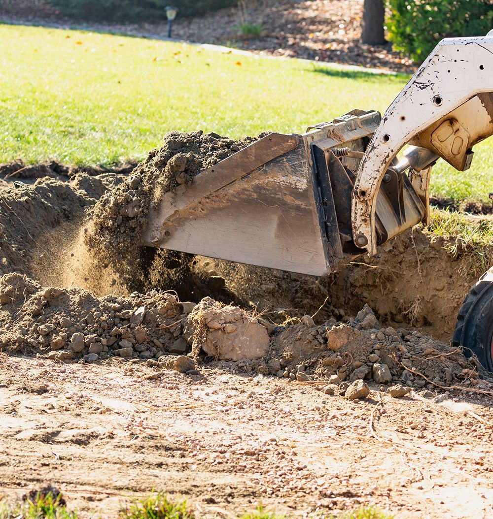 A bulldozer is digging a hole in the ground.