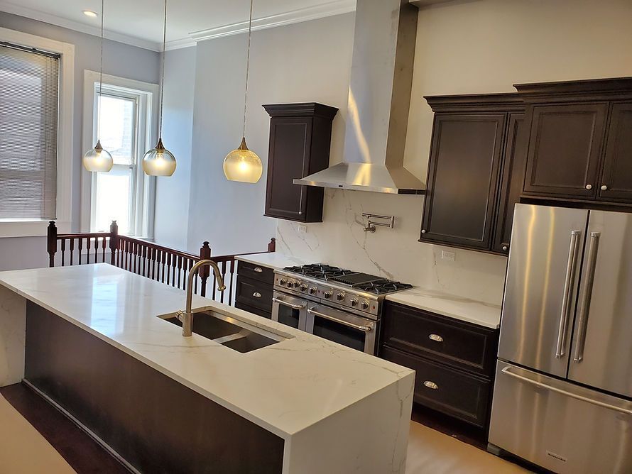 A Kitchen With Stainless Steel Appliances and Countertop