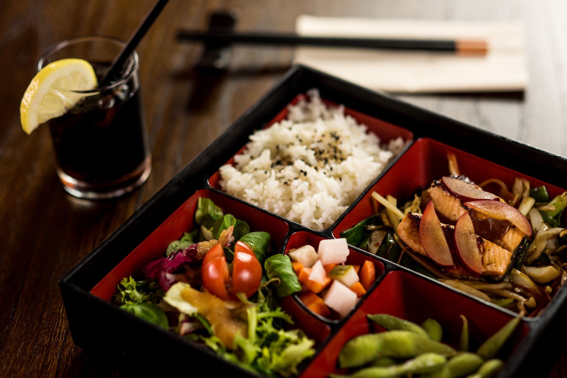 A sunset over a mountain range with a lot of fog