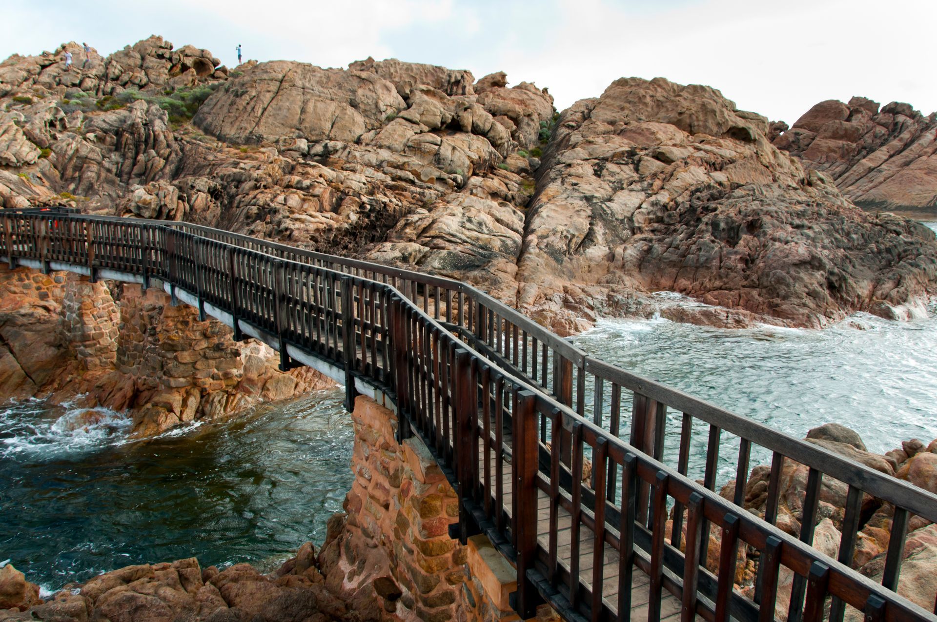 A sunset over a mountain range with a lot of fog