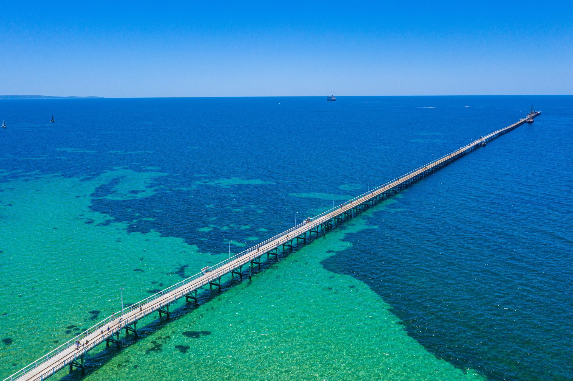 A sunset over a mountain range with a lot of fog