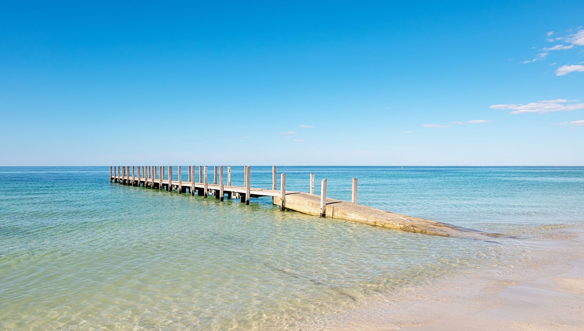 A sunset over a mountain range with a lot of fog