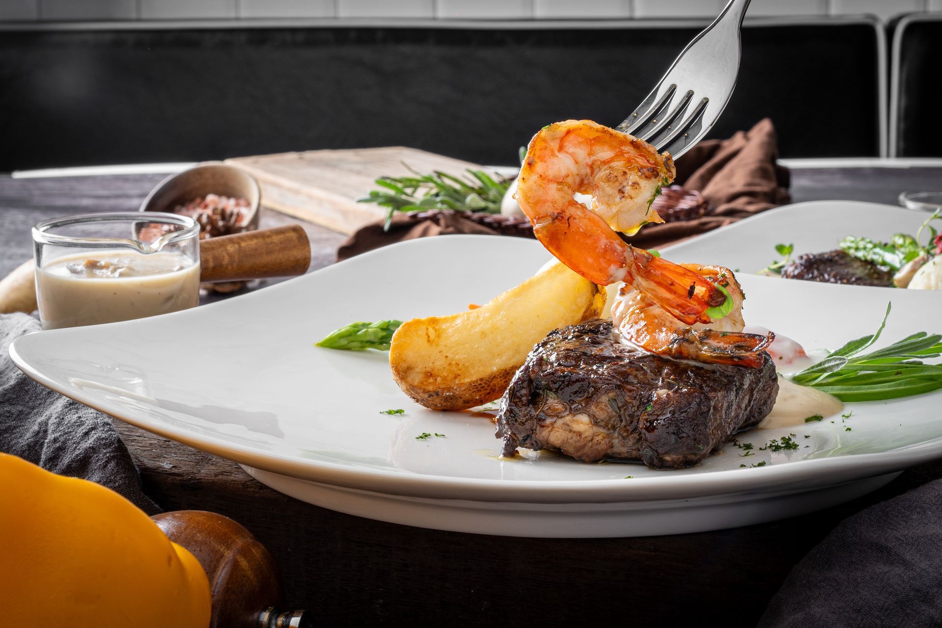 A sunset over a mountain range with a lot of fog