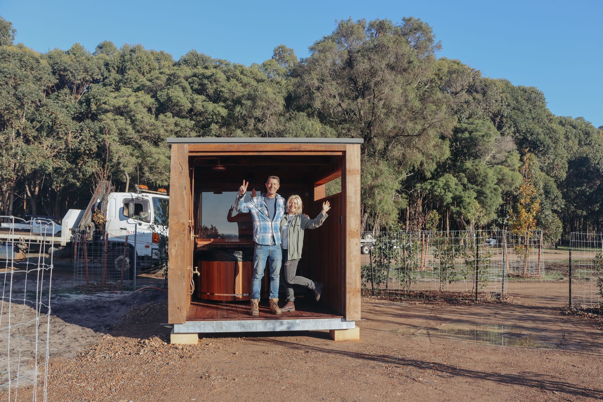 A sunset over a mountain range with a lot of fog