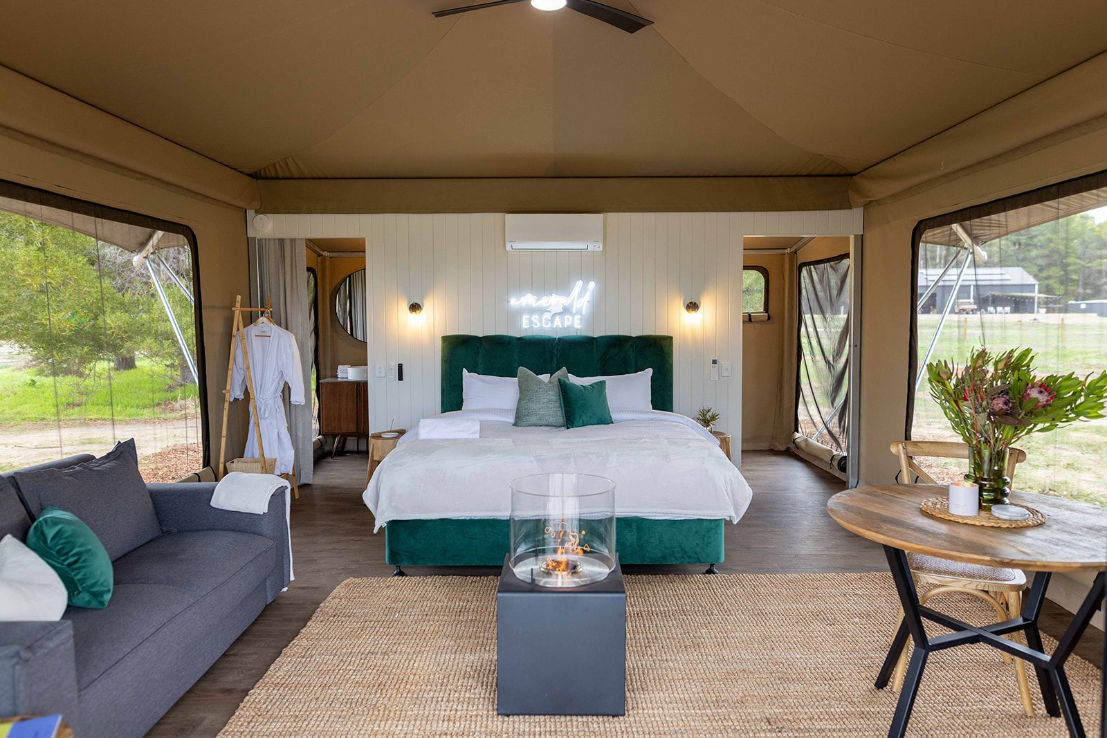 A sunset over a mountain range with a lot of fog