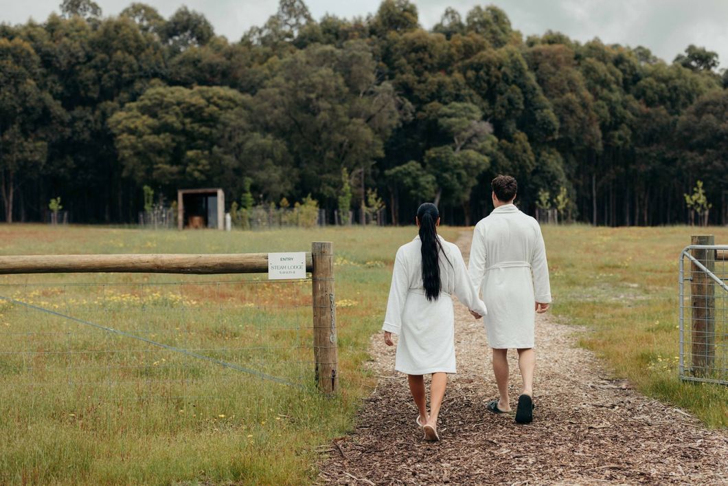 A sunset over a mountain range with a lot of fog