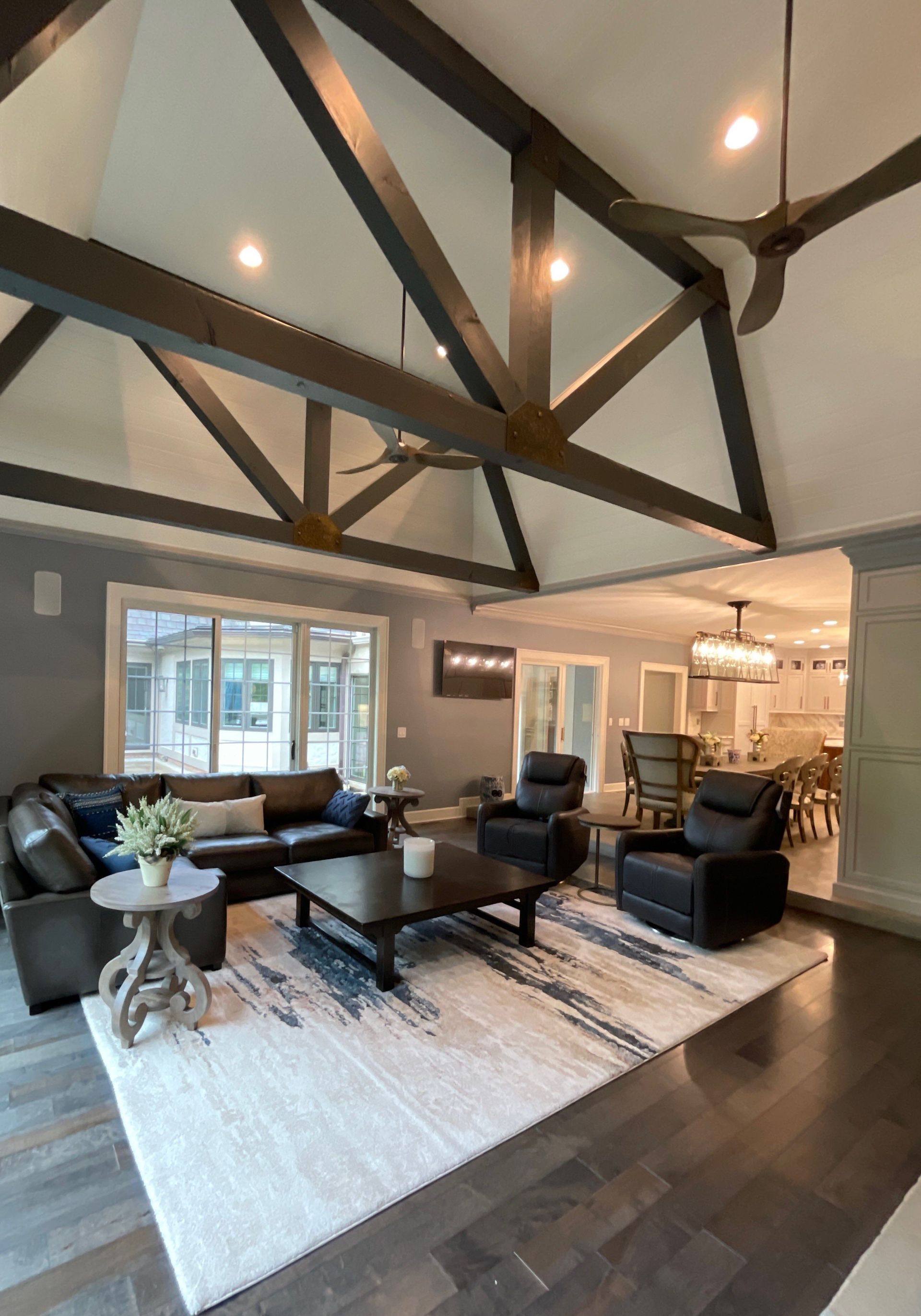 A living room filled with furniture and a ceiling fan.