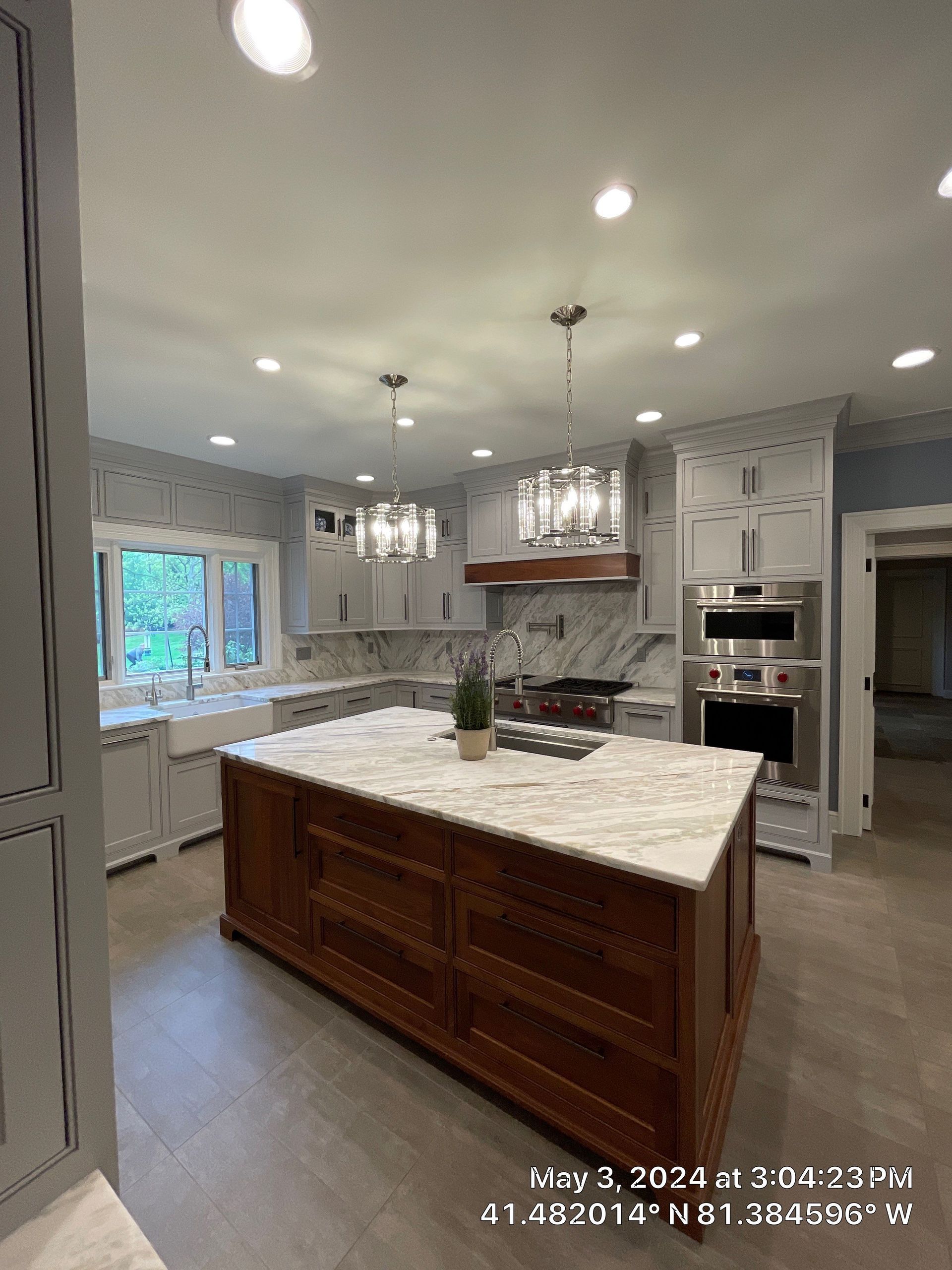 A kitchen with a large island in the middle of it.