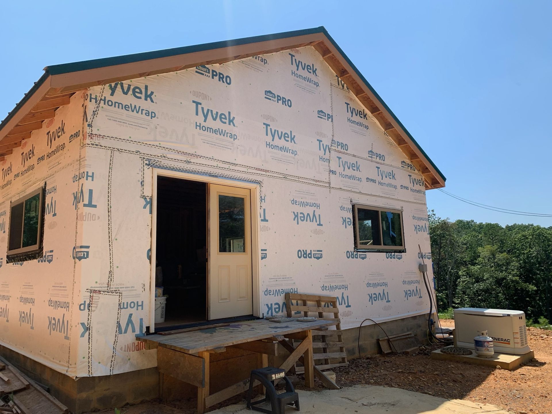 A small house is being built with tyvek insulation