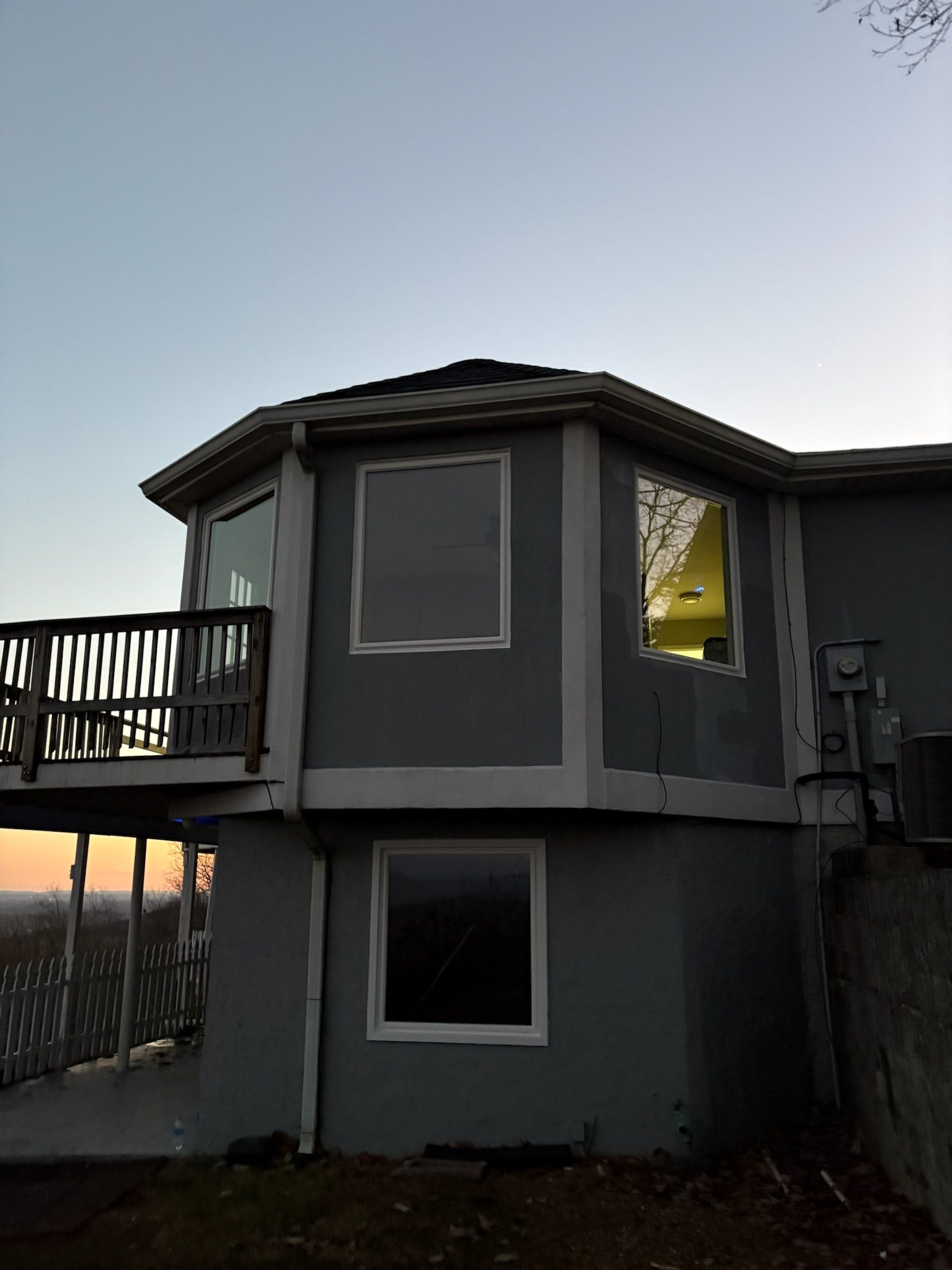A house with a balcony and a lot of windows