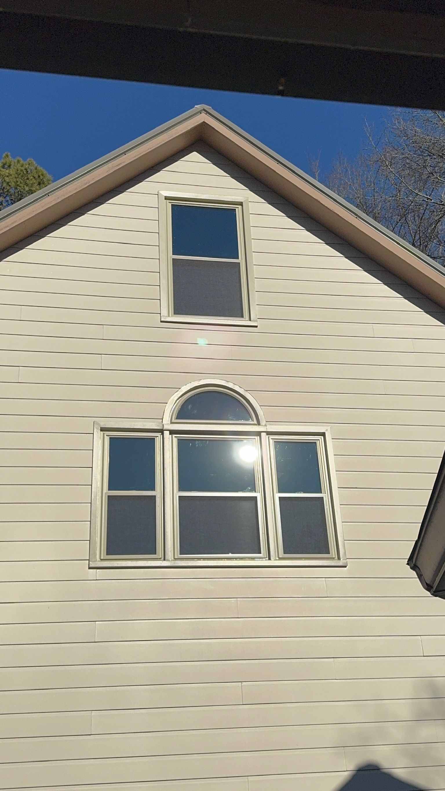 The sun is shining through the windows of a house