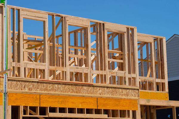 A house is being built with a lot of wooden frames.