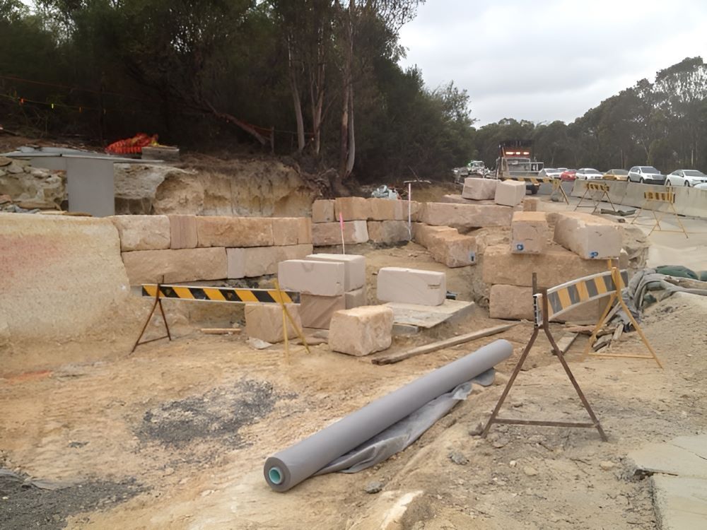A Construction Site with A Lot of Blocks and A Ladder — Adam Lowe Earthmoving Pty Ltd in Somersby, NSW