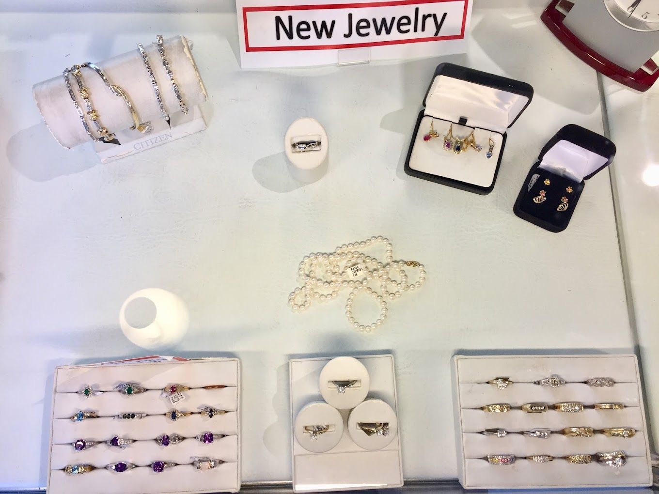 a display of new jewelry including bracelets and rings