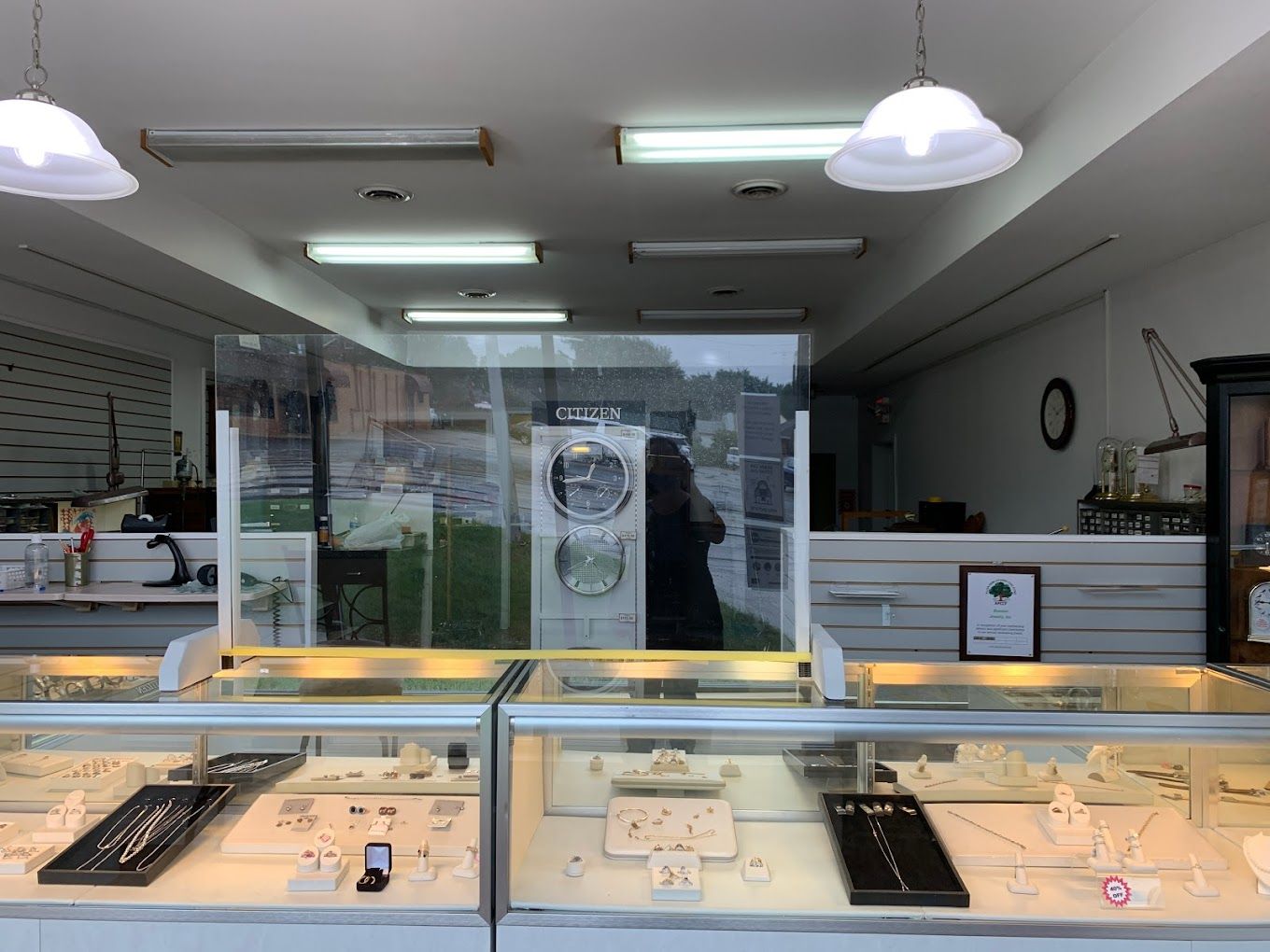 a jewelry store with a glass display case filled with jewelry .