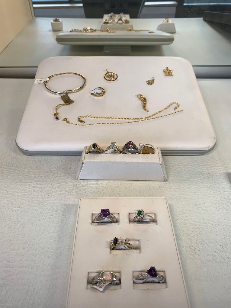 a person is working on a bracelet with a pair of tweezers