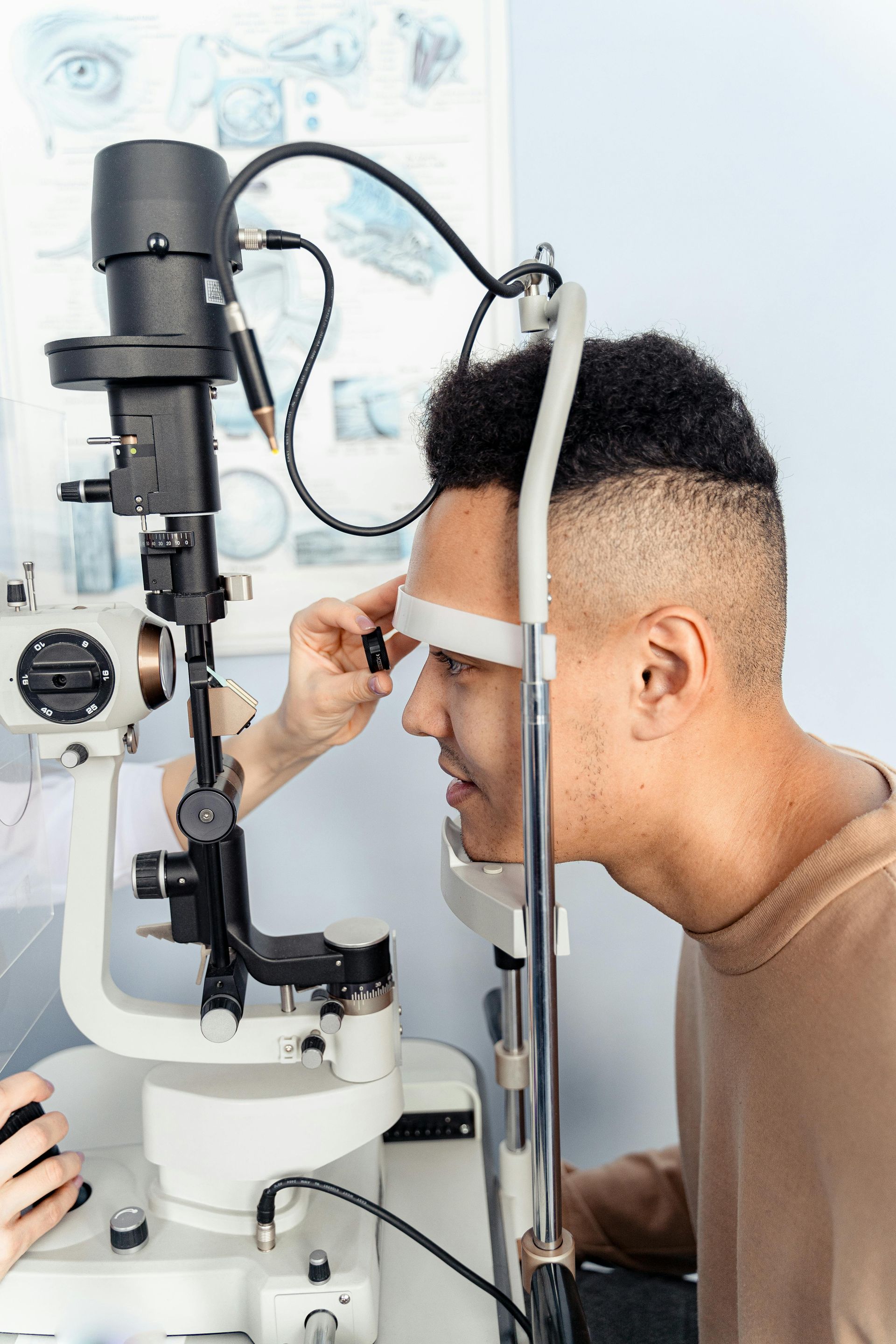 A man is getting his eyes examined by an ophthalmologist.