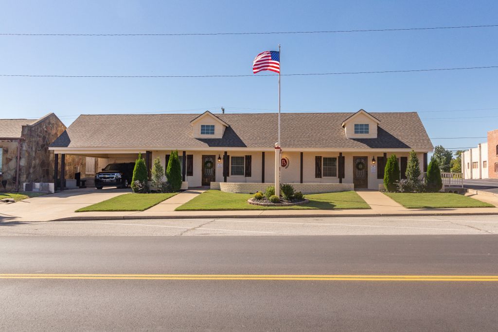 A house with an american flag flying in front of it