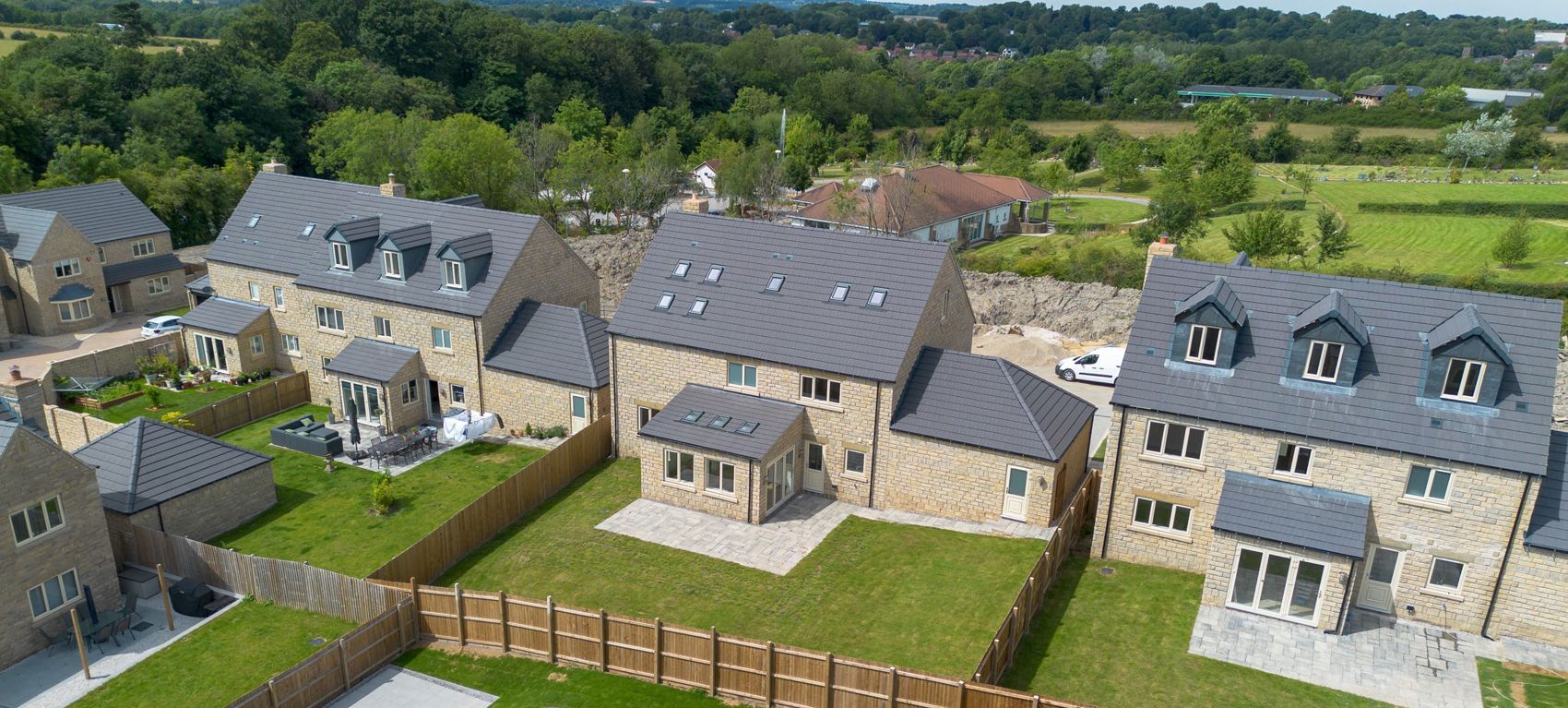 An aerial view of a row of houses in a residential area.