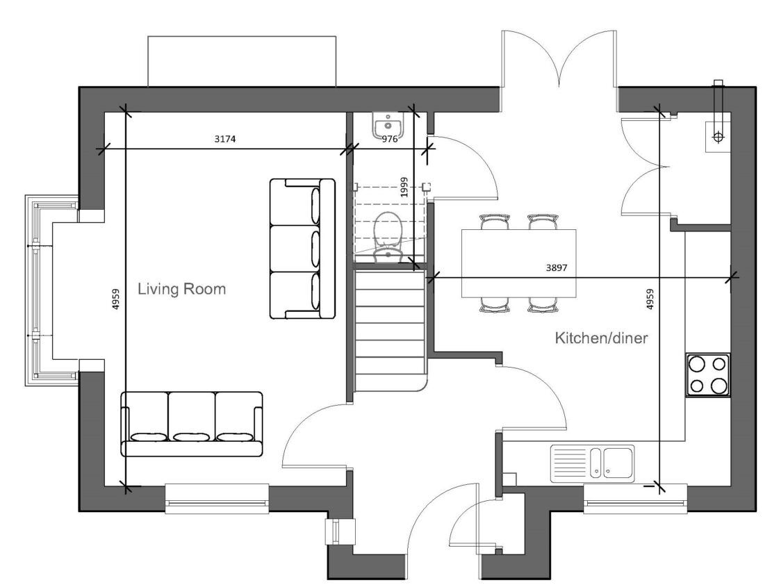 A black and white floor plan of a house with a couch and stairs.