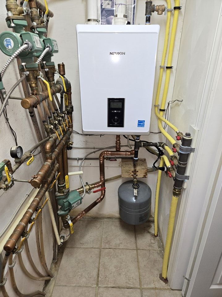 A room with a boiler and a lot of pipes