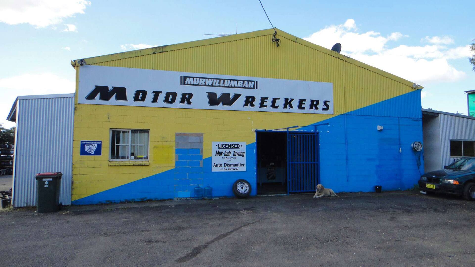 A Yellow and Blue Building That Says Motor Wreckers — Murwillumbah Motor Wreckers in South Murwillumbah, NSW