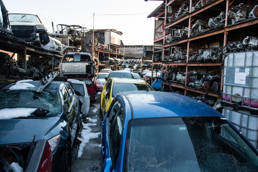 A Bunch of Cars Are Sitting on Top of Each Other in a Junkyard — Murwillumbah Motor Wreckers In Gold Coast, QLD