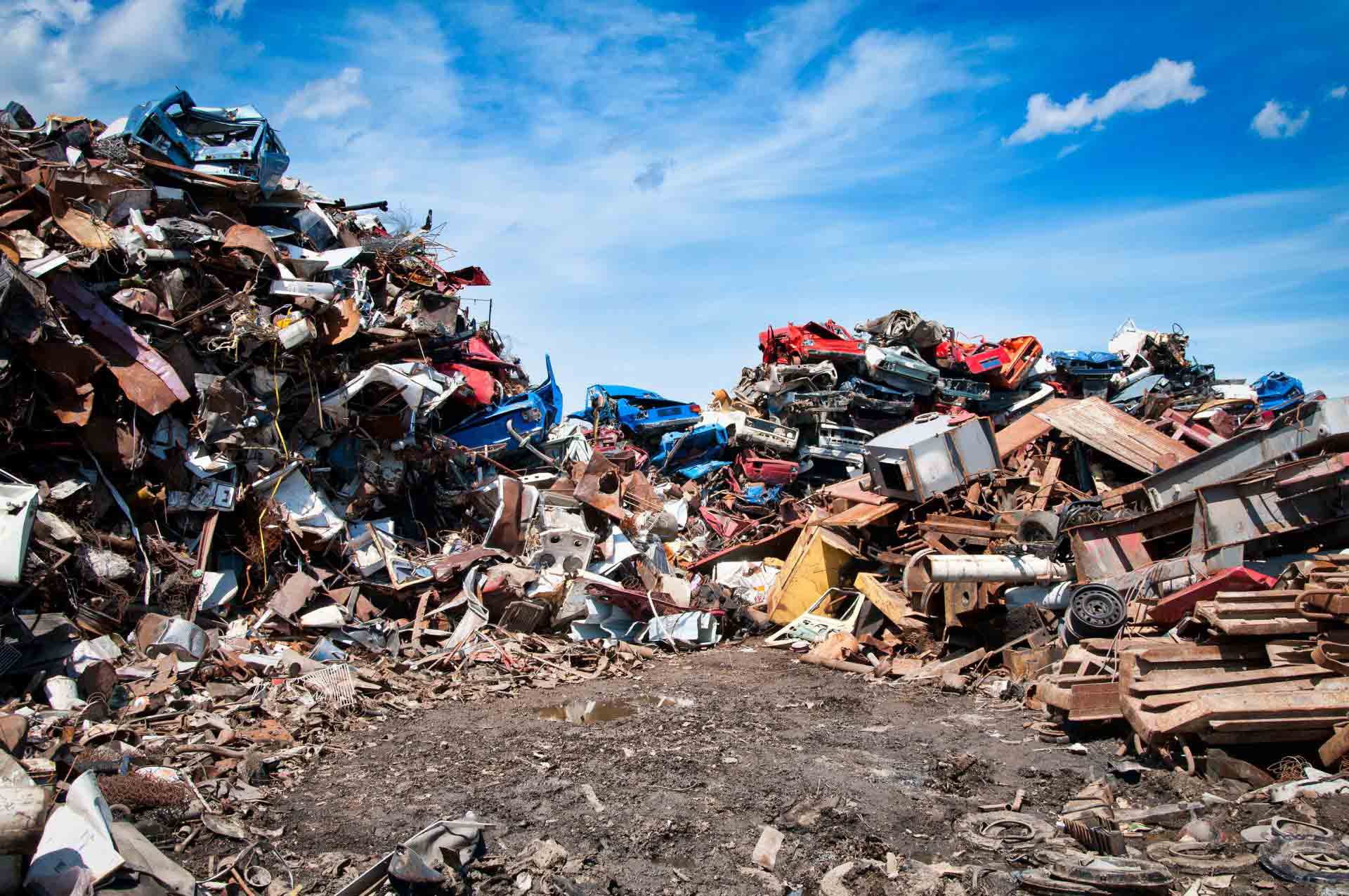 A Large Pile of Scrap Metal is Sitting on Top of a Dirt Field — Murwillumbah Motor Wreckers in South Murwillumbah, NSW