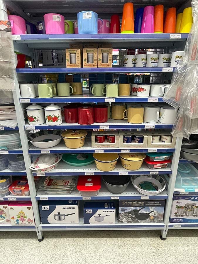 A Store Shelf Filled With Lots of Mugs and Bowls — Pigglys Supermarket, Takeaway & Bottle Shop in The Gap, NT