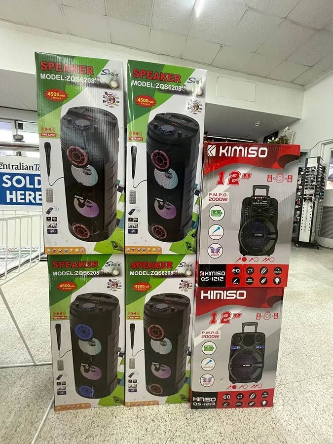 A Bunch of Speakers Are Stacked on Top of Each Other in a Store — Pigglys Supermarket, Takeaway & Bottle Shop in The Gap, NT