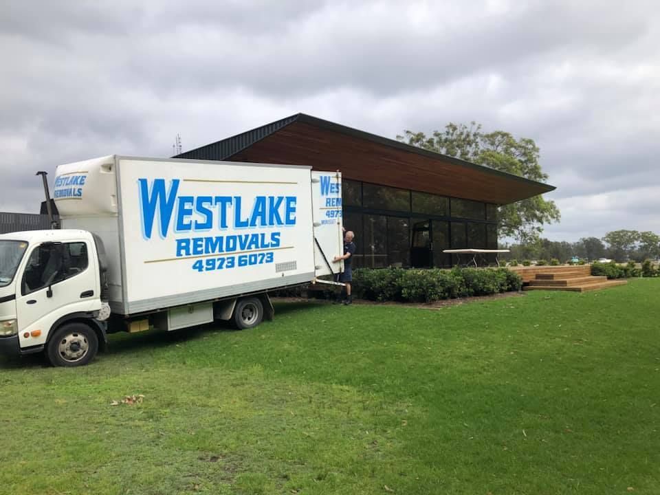 White Moving Truck from Westlake Removals Parked Next to A Building — Westlake Removals in Trinity Point, NSW
