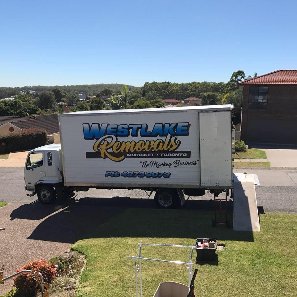 White Moving Truck, Westlake Removals Logo, Parked on A Suburban Street — Westlake Removals in Cooranbong, NSW