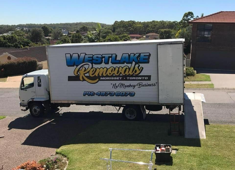 White Moving Truck, Westlake Removals Logo, Parked on A Residential Driveway — Westlake Removals in Morisset, NSW