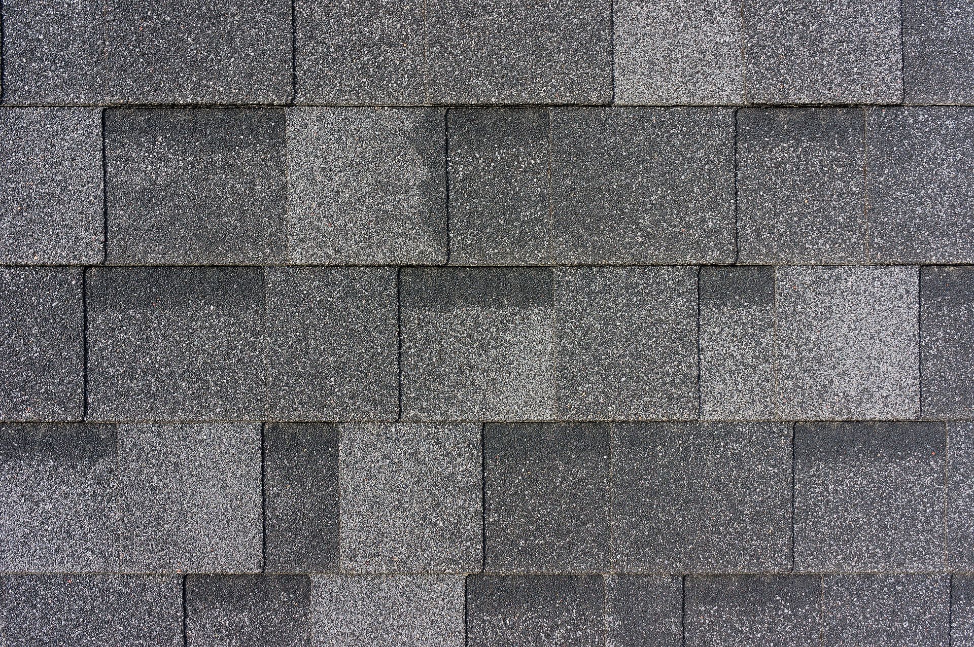 A close up of a roof with shingles on it.