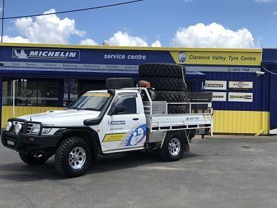 A White Truck Is Parked In Front Of A Michelin Tire Store — Clarence Valley Tyre Centre in South Grafton, NSW