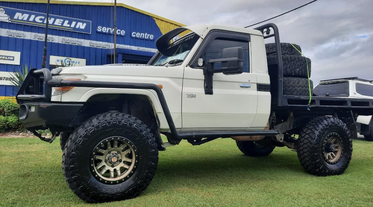 A White Truck With A Tray On The Back Is Parked In Front Of A Building — Clarence Valley Tyre Centre in South Grafton, NSW