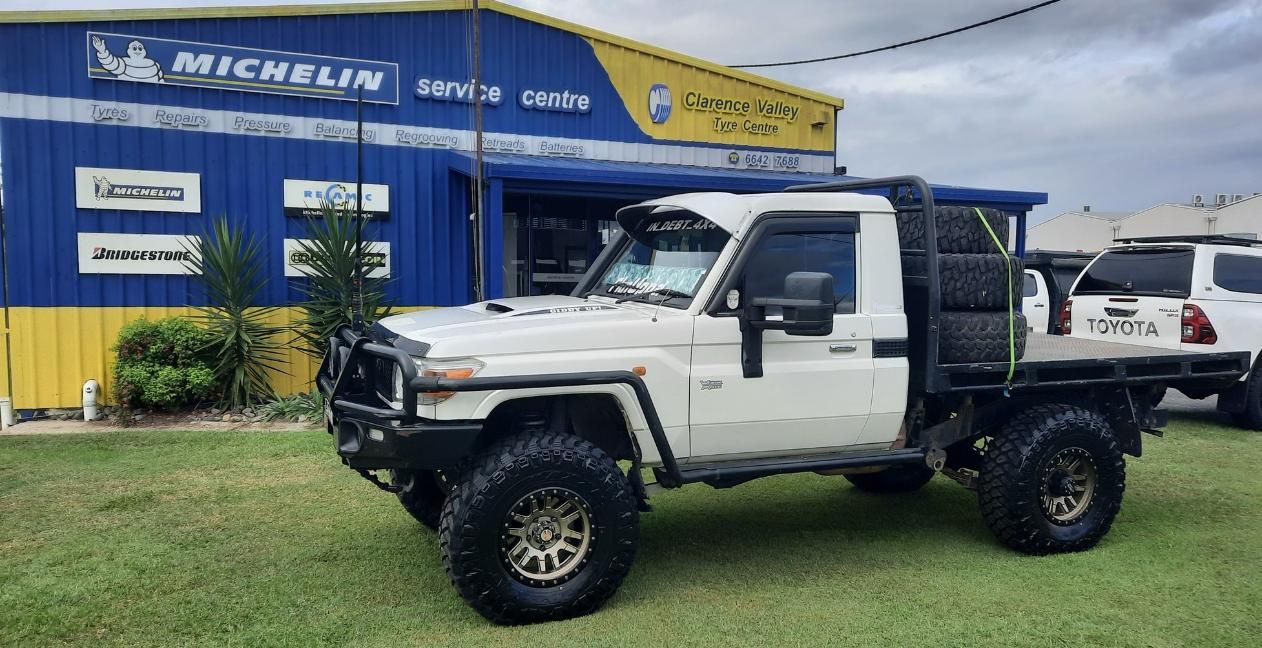 A White Truck Is Parked In Front Of A Building — Clarence Valley Tyre Centre in South Grafton, NSW