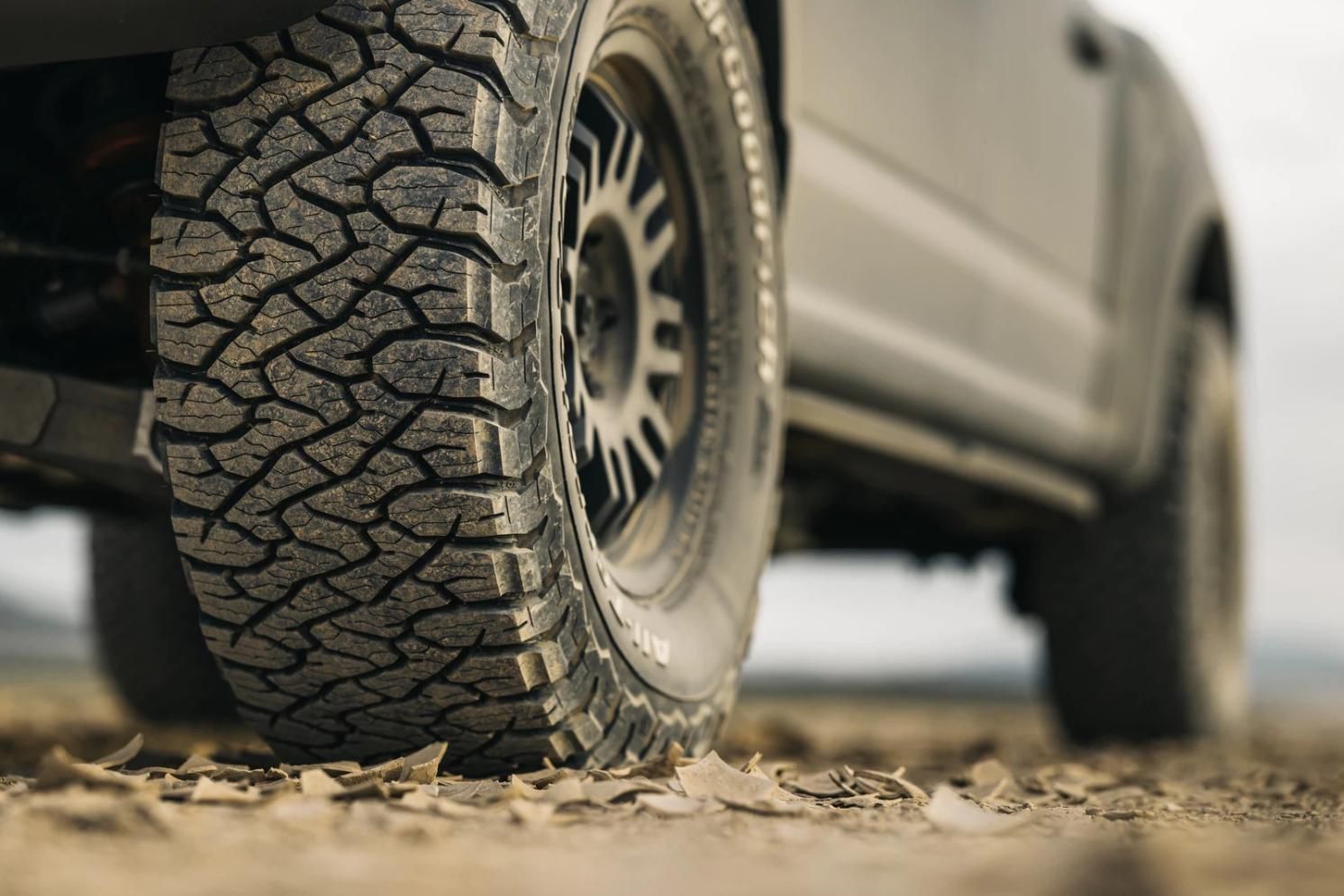 A Close Up Of A Tire On A Truck On A Dirt Road — Clarence Valley Tyre Centre in South Grafton, NSW
