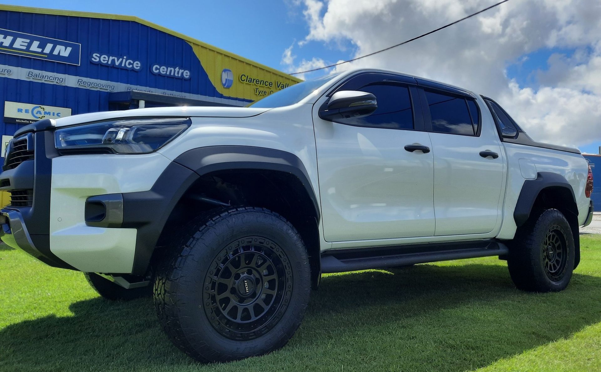 Close Up Of A White Truck Parked Outside A Shop— Clarence Valley Tyre Centre in South Grafton, NSW