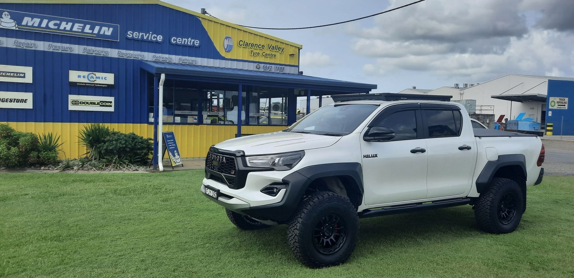 A white truck is parked in front of a building — Clarence Valley Tyre Centre in South Grafton, NSW