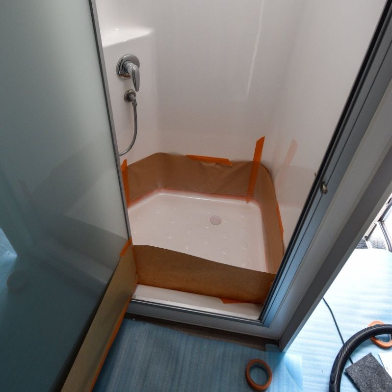 A Shower Stall is Taped to the Wall With Brown Tape — Sandy Straits Marine In Urangan, QLD
