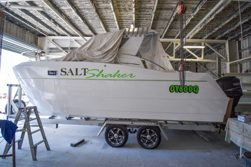 A White Boat With the Word Salt Shaker on It — Sandy Straits Marine In Urangan, QLD