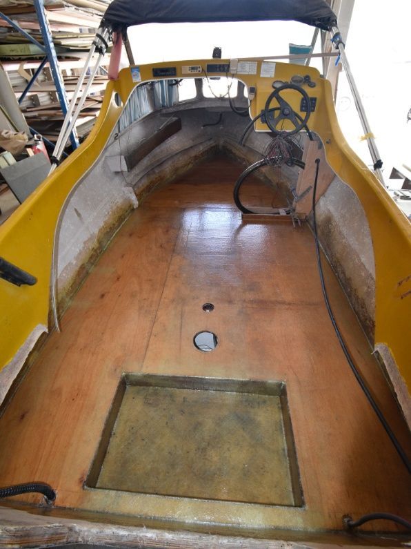 The Inside of a Yellow Boat With a Steering Wheel — Sandy Straits Marine In Urangan, QLD