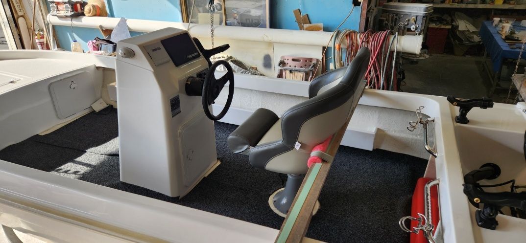 A Boat With a Steering Wheel — Sandy Straits Marine In Urangan, QLD