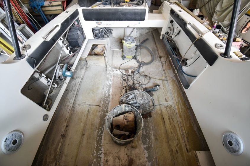 The Inside of a Boat With a Bucket on the Floor — Sandy Straits Marine In Urangan, QLD